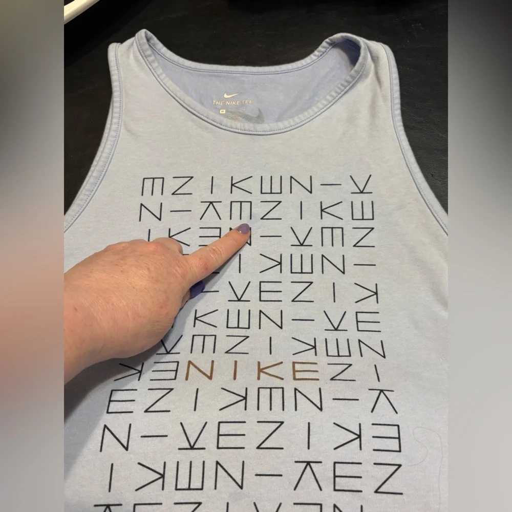 Nike light blue tank top with logo pattern. Size Medium.